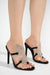 High-heeled mule sandals with clear mesh and rhinestone butterfly details.